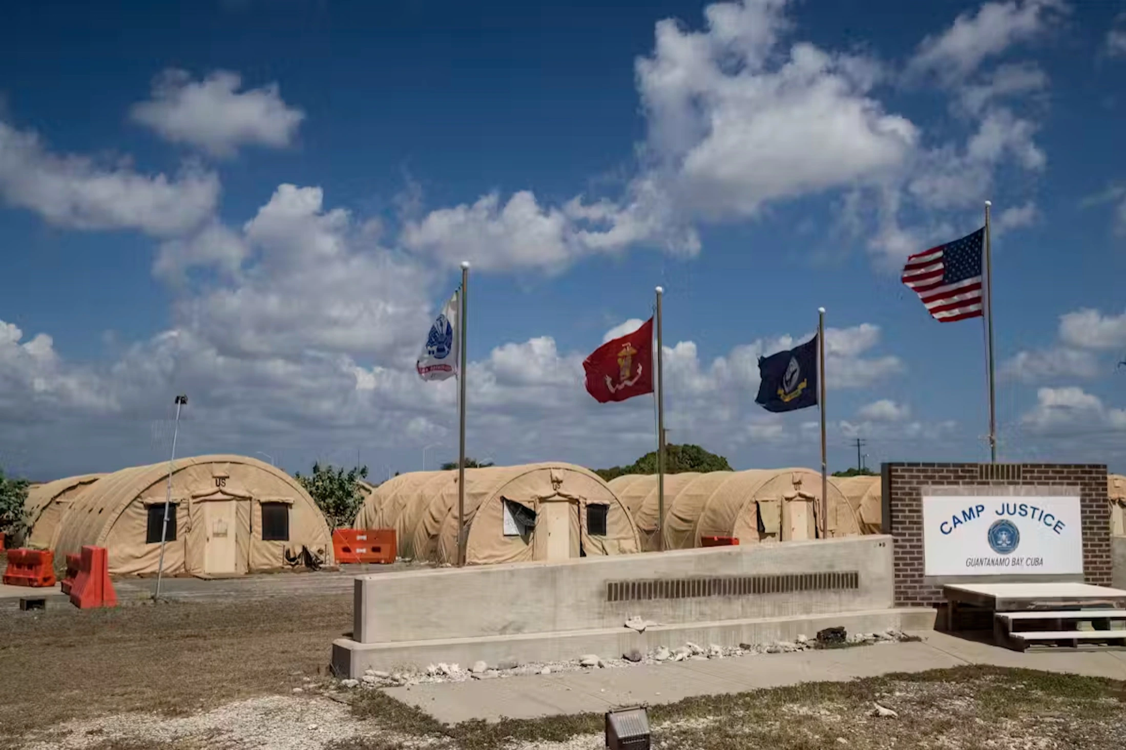 Flags fly in front of the tents of Camp Justice in Guantanamo Bay Naval Base, Cuba, in April 2019. 