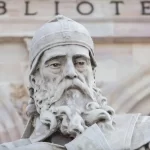 Stone statue of Saint Isidore of Seville at the National Library of Spain.