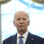 President Joe Biden pauses during a photo opportunity with Medal of Valor recipients in the Oval Office of the White House in Washington, Friday, Jan. 3, 2025.