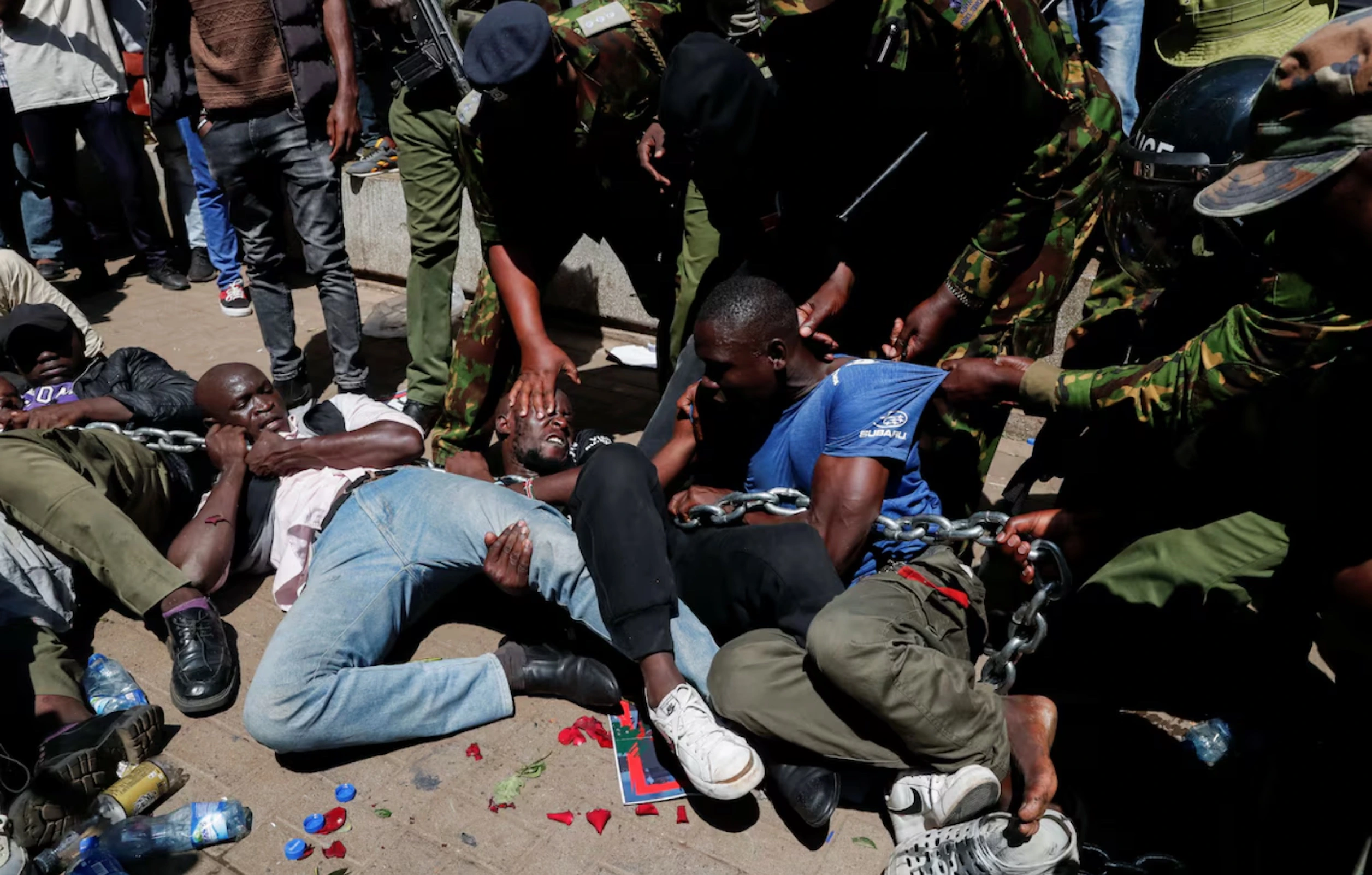 Riot police officers detain protesters demonstrating against what they say is a wave of unexplained abductions of government critics, along the Aga Khan walk in downtown Nairobi, Kenya December 30, 2024.