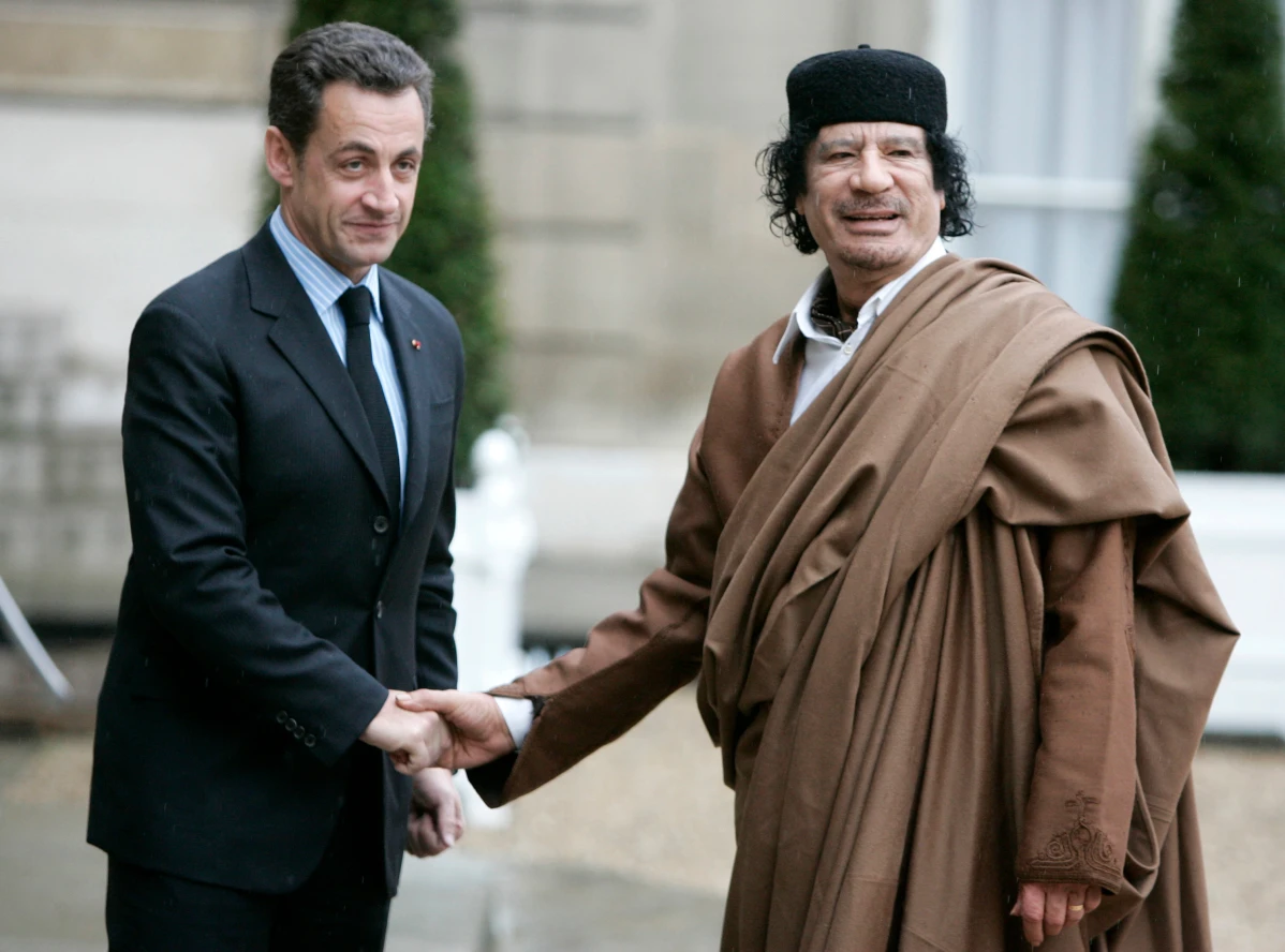 French President Nicolas Sarkozy, left, greets Libyan leader Col. Moammar Gadhafi upon his arrival at the Elysee Palace, Dec. 10 2007 in Paris. France’s former President Nicolas Sarkozy goes on trial Monday Jan.6, 2025 over alleged illegal financing of his 2007 presidential campaign by the government of late Libyan leader Moammar Gadhafi. 