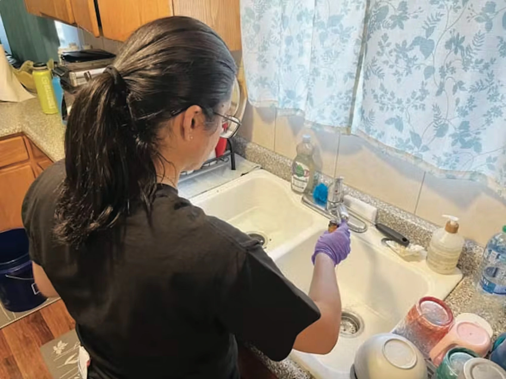 Purdue University graduate student Paula Coelho conducts tests for water quality. Home drinking water testing can be helpful once the water provider has confirmed that the water being delivered is now safe. 