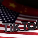 TikTok logo is placed on the U.S. and Chinese flags in this illustration taken, April 25, 2024.